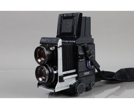 A Mamiya C330 Professional F TLR Camera, serial no D124976, body VG, bellows VG, with Mamiya Sekor 80mm f/2.8 blue dot lens, 