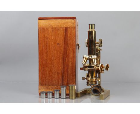 A late 19th Century/early 20th Century lacquered brass Ross Compound Monocular Microscope,  serial no. 6065, with two eyepiec
