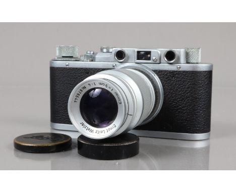 A Leitz Wetzlar Leica II Rangefinder Camera, serial no 2465513, 1937/38, shutter working, rangefinder working, body G, scratc