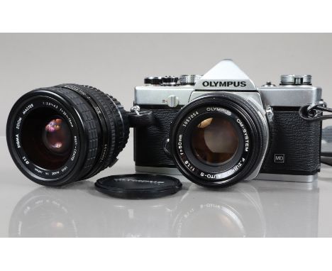 An Olympus OM-1 MD SLR Camera, serial no 1543218, shutter working, meter responsive, self timer working, body G-VG, some ligh