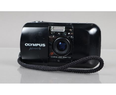 An Olympus mju 1 Compact Camera, powers up, shutter working, flash working, self timer working, body G, some scratches, light