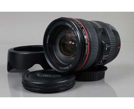 A Canon EF 24-105mm f/4 L IS USM Lens, serial no 386196, auto focus working, barrel G, red plastic ring broken, some light we