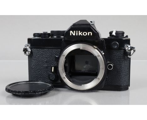 A Nikon FM Camera Body, black, shutter working, meter responsive, self timer working, body G, light wear, with body cap 