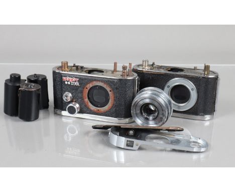 Robot Camera Parts, including a Robot ** Star body, a Robot II body, film cartridges, top plates, springs, dials and other pa