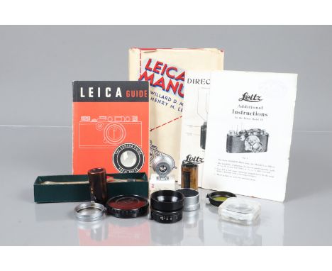Leitz Accessories, including a SGVOO 9cm finder, VG, in maker's box, an Elmar 5cm hood, two Leitz 35mm film canisters, a yell