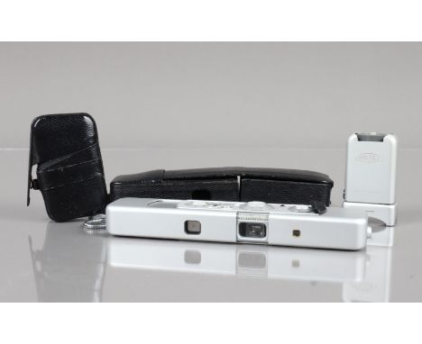 A Minox C Sub Miniature Camera, shutter working, not battery tested, body G-VG, elements G-VG, with C4 cube flash adapter, wi