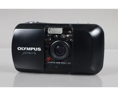 An Olympus mju 1 Compact Camera,  powers up, shutter working, flash working, self timer working, body G-VG, light wear, eleme