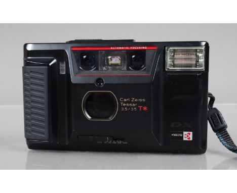 A Kyocera Yashica T AF DX Compact camera, shutter working, flash working, self timer working, body G, light wear, with Carl Z