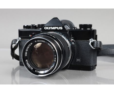 An Olympus OM-1 MD SLR Camera,  black, serial no 394523, shutter working, meter working, self timer working, body G-VG, with 