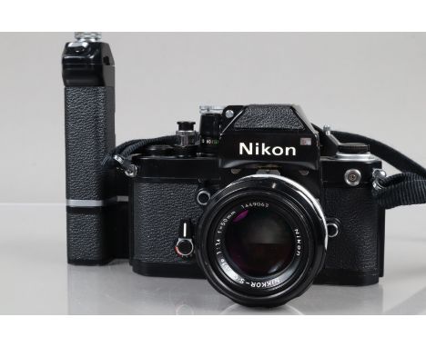 A Nikon F2 Photomic SLR Camera, black, serial no F2 7962378, shutter working, self timer working, with DP-1 finder, meter res