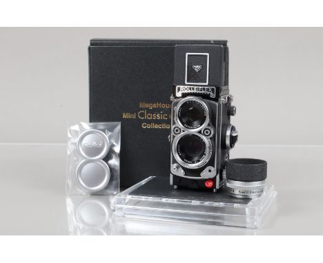 A MegaHouse Mini Classic Rolleiflex 2.8F Miniature Camera, single speed shutter working, body VG-E, elements VG-E, in perspex