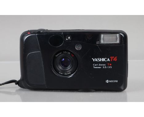 A Yashica T4 Compact Camera, shutter working, flash working, self timer working, body G, some scratches, with Carl Zeiss T* 3