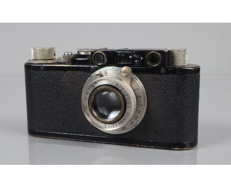 A Leitz Wetzlar Leica II Rangefinder Camera, serial no 77673, 1932, shutter working, body G, brassing to edges, bottom catch 