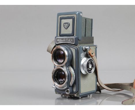 A Rolleiflex Baby Grey TLR Camera, serial no 2036421, shutter sluggish on slow speeds, body G, some wear, light grime, with S