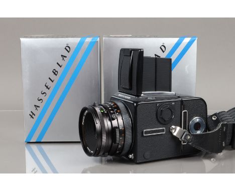 A Hasselblad 503 CX Camera, black, body serial no 11ES10554, shutter working, body VG, with body cap, back cover, strap, body