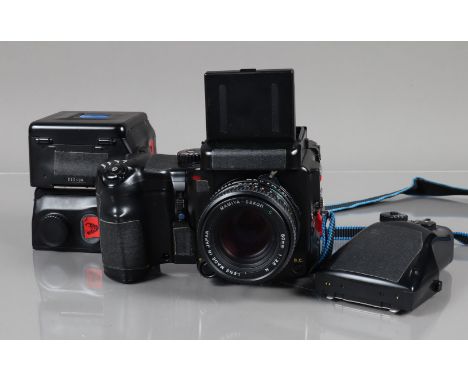 A Mamiya 645 Pro Camera, serial no PF1435, shutter working, body F-G, with black tape on grip and over name plate, signs of t