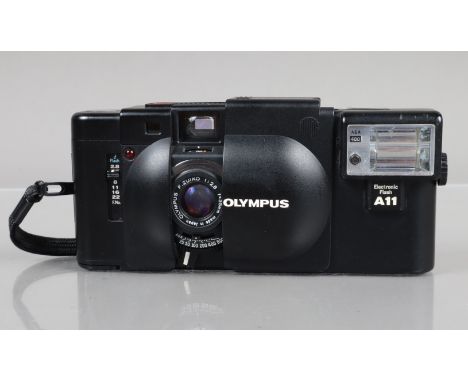 An Olympus XA Compact Camera, shutter working, rangefinder working, self timer working, body G-VG, elements VG, with A11 flas