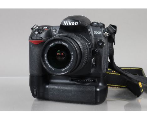 A Nikon D200 DSLR Camera, serial no 8038755, powers up, shutter working, appears to function as should, with Nikkor DX VR AFS