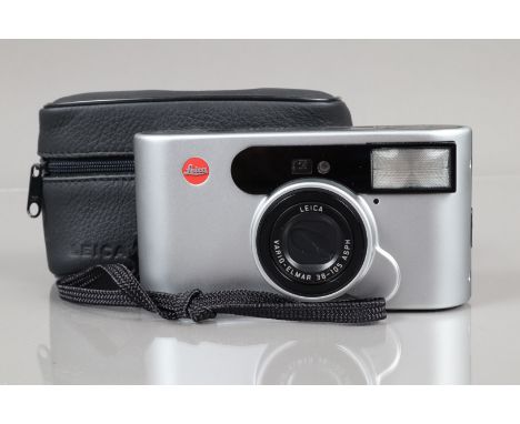 A Leica C1 Compact camera, powers up, shutter working, flash working, self timer working, body G-VG, some wear to battery cov