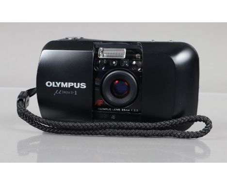 An Olympus mju 1 Compact Camera, powers up, shutter working, flash working, self timer working, body G-VG, light wear, elemen