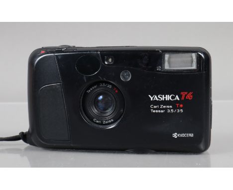 A Yashica T4 Compact Camera, shutter working, flash working, self timer working, body G, some scratches, with Carl Zeiss T* 3