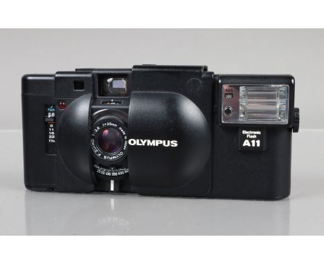 An Olympus XA Compact Camera, shutter working, rangefinder working, self timer working, body G-VG, elements VG, with A11 flas