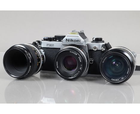 A Nikon FM2 SLR Camera, serial no 7805421, shutter working, meter working, self timer working, body VG, with Nikkor 50mm f/1.