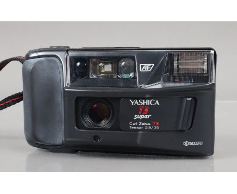 A Yashica T3 Super Compact Camera, shutter working, flash working, self timer working, body G, light wear, some fading to gri