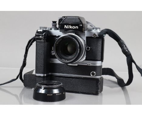 A Nikon F2 Photomic SLR Camera, chrome, serial no F2 7691809, shutter working, self timer working, with DP-1 finder, meter re