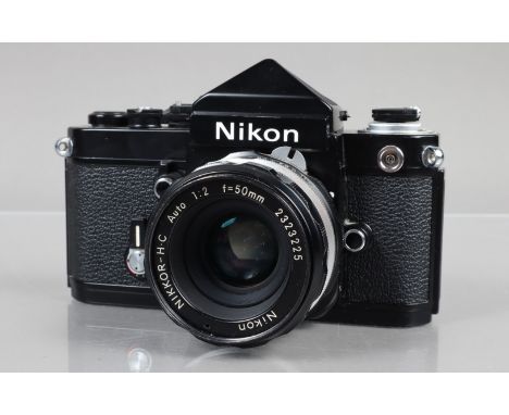 A Nikon F2 SLR Camera, black, serial no 7962380, shutter working, self timer working, with DE-1 eye level finder, body G-VG, 