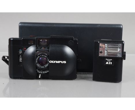 An Olympus XA Compact Camera, powers up, shutter working, self timer working, rangefinder working, body VG, elements VG, in X