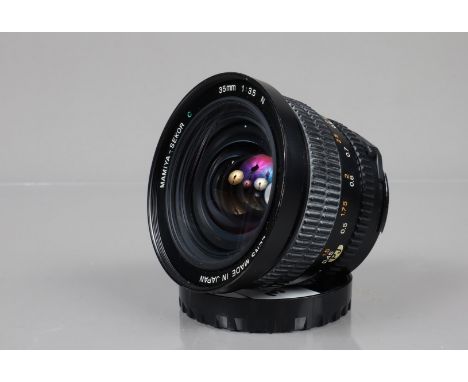 A Mamiya-Sekor C 35mm f/3.5 N Lens, Mamiya 645 mount, serial no 109323, barrel G, light paint wear to hood, light fading to g