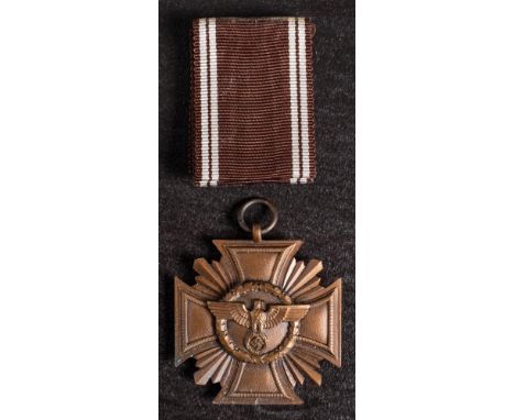 A Third Reich NSDAP Ten Years Long Service Award in bronze: with ribbon in box of issue. (mildew to box and reverse of medal 