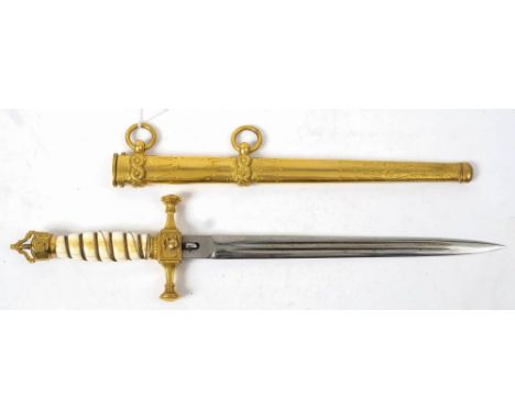 An Imperial German Naval Dirk: the straight double edged and double fullered blade with traces of acid etched decoration over