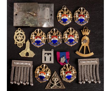 A group of various Masonic jewels: comprising seven silver gilt and enamel jewels, a square steel mould for casting set squar