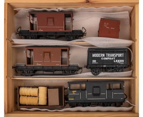 A group of O gauge rolling stock including a built brass BR 'Shark' ballast brake DB993086 in black:, two BR guards vans, a S