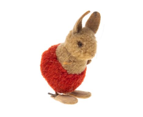 A mid 20th century Steiff puff ball rabbit, circa 1950s/60s: with felt ears and glass eye, red shorts, wire legs and felt sho
