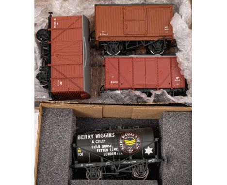 Two Skytrex O gauge BR box wagons: together with one other box wagon and a Berry Wiggins &amp; Co Ltd tank wagon in associate