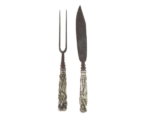 An 18th century knife and fork unmarked, the heavy cast male figural handles with traces of gilding, steel two prong fork, th