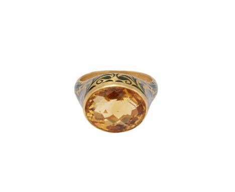 A citrine and enamel set ring collet set with an oval fancy-cut citrine, the raised setting and shoulders with green foliate 