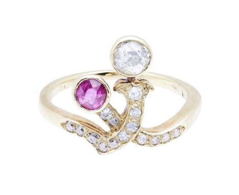 A ruby and diamond set ring composed of intertwined bands pavé set with round-cut diamonds, each terminating with a collet se