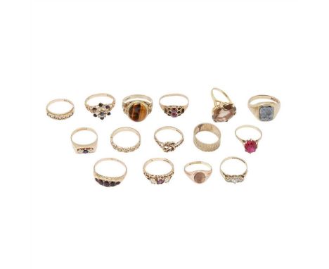 A collection of 9ct gold gem set rings to include a large citrine set cocktail ring, a tigers-eye set signet ring; a haematit