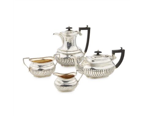 A matched four piece tea service Birmingham 1910/13, comprising water pot and teapot by Jones &amp; Crompton and twin handled