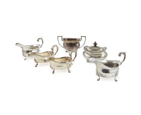 Two pairs of sauce boats the first pair, George III sauce boats, circa 1790, of conventional form, gadrooned border, engraved