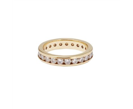 An 18ct gold diamond set eternity ring c hannel set with a continuous row of round brilliant-cut diamonds (Dimensions: Ring s