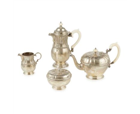 Y A matched four piece tea service Adie Bros Ltd., London 1923/6, comprising a waterpot, teapot, sugar basin with pull off li