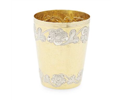 A continental silver and parcel gilt beaker makers mark AFC for Lisbon 1891-1937, of tapered form, embossed silver floral bor