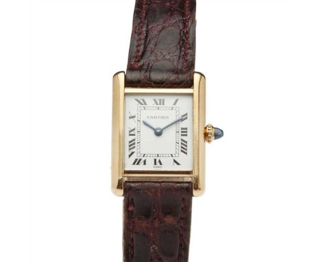 A lady's 18ct gold cased wrist watch, Must de Cartier Tank model, plain rectangular dial, Roman numerals, sapphire crown, man