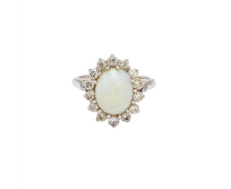An opal and diamond set cluster ring claw set with an oval opal cabochon, in a border of round brilliant-cut diamonds, to a p