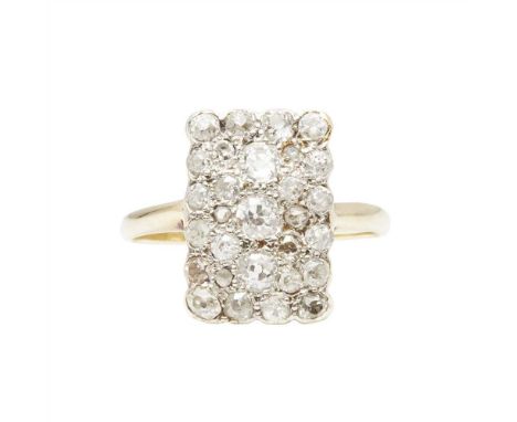 A diamond set plaque ring pavé set with various old round-cut diamonds, to a plain yellow metal shank stamped indistinctly 18